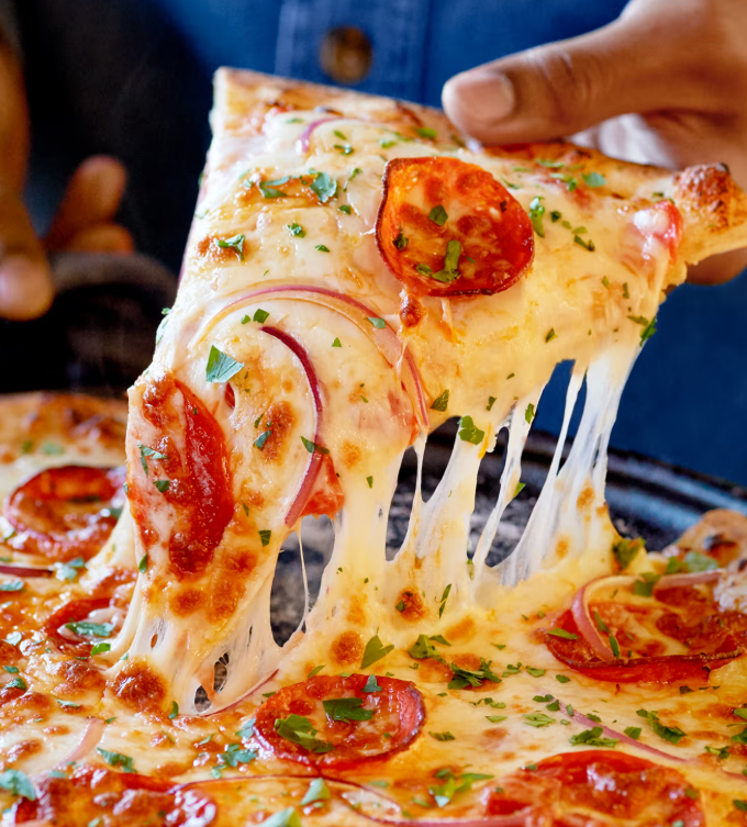 A freshly baked pizza slice with melted cheese